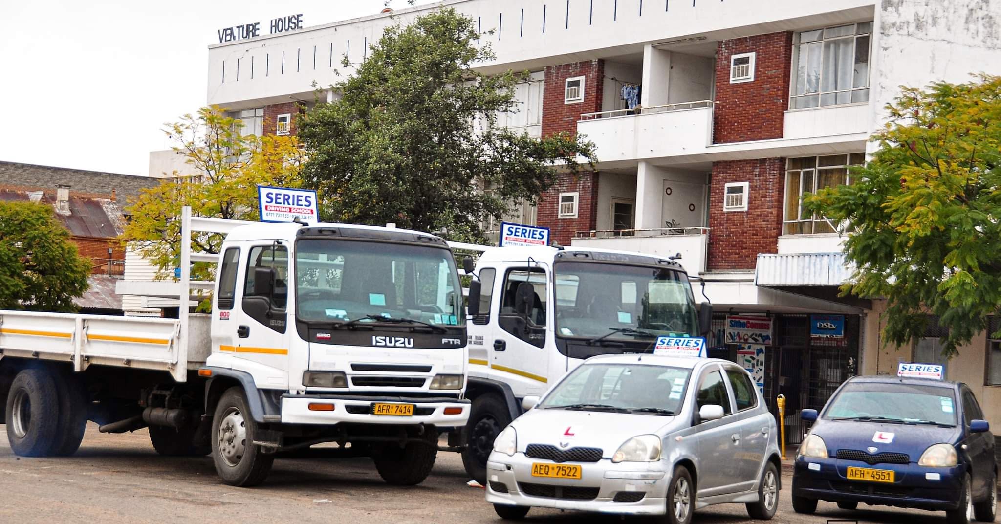 Series Driving School fleet parked outside Venture House